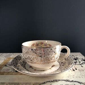 - Parisian center 22-k gold Flat Cup & Saucer Set